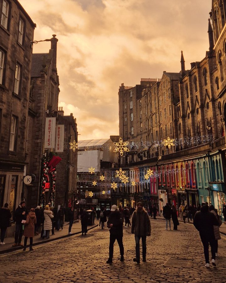 Victoria Street in Edinburgh, strung with Christmas lights