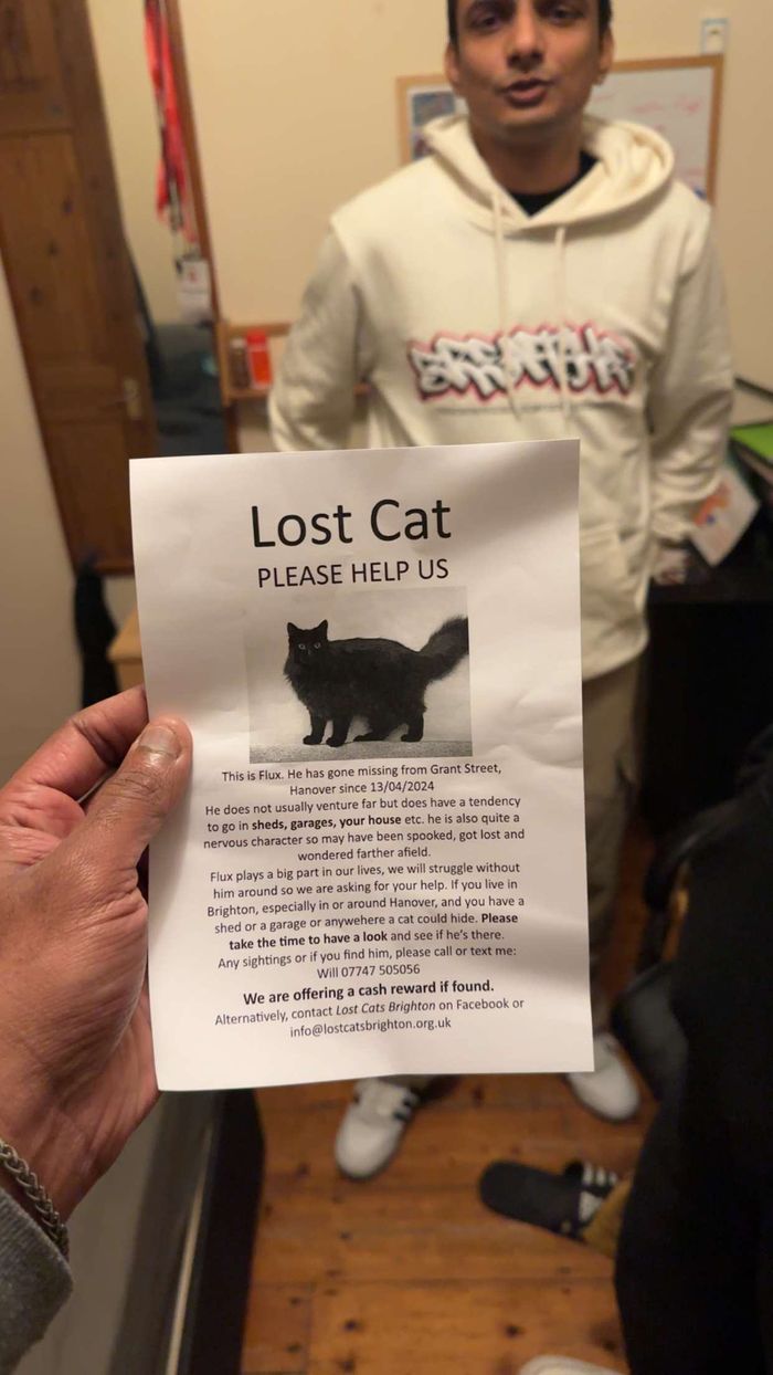 A neighbour holding a Lost Cat poster